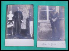A vintage picture scrap book filled with many images and postcards of a military nature,many of