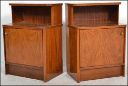 A pair of 1930's Art Deco walnut bedside cabinets - lockers. Each with single doors being true to