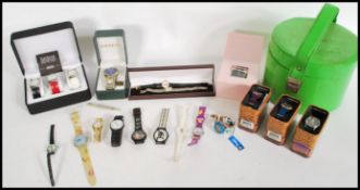 A group of vintage watches to include Swatch, boxed Harry Potter watches, boxed Playboy, Hello