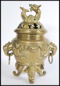 A large 20th century Chinese heavy brass censer ding prayer incense burner having water dragon