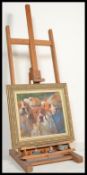 A wooden hinged artist's easel originally owned by Michael Coote who studied as a photo