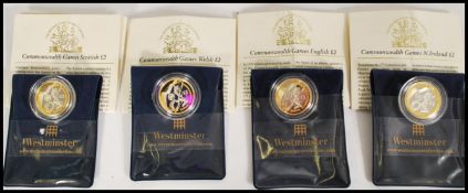 A selection of 2002 commemorative silver and gold two pound coins to include a commonwealth games