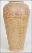A large Chinese 20th century floor standing stick stand vase having scrolled floral patterns.