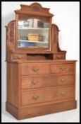 A late 19th century Art Nouveau Satin Walnut dressing table chest with swing mirror over three