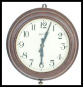 A vintage mid 20th Century Smiths bakelite station / factory wall clock, roman numeral chapter