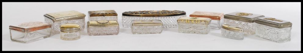 A large collection of ladies dressing table vanity pots to include silver plated, copper, brass