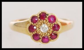 A late 19th century Victorian hallmarked 18ct gold cluster ring with an approx 5pts central