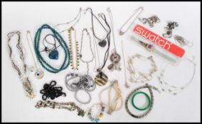 A collection of vintage costumer jewellery to include necklaces, bracelets, jade bangle, boxed