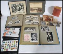 Box with two scrap book type albums documenting overseas travels with postcards, photos and