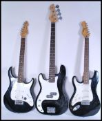 A group of three vintage electric guitars to include an Encore example , Peavey Raptor Plus EXP