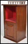 An Edwardian mahogany pedestal pot cupboard with plinth base, full length door with shelved