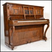 An Edwardian / early 20th Century Art Nouveau figured walnut upright iron bound piano by Nathaniel