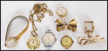 A selection of vintage 20th century timepieces to include and Optima round faced ladies watch in a