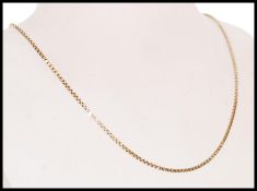 A stamped 9ct gold box chain necklace with a spring ring clasp, item weighs 6.5g. Measures 42 cm