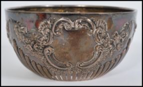A silver hallmarked late Victorian Rococo bowl, decorated in relief with swag detail design,