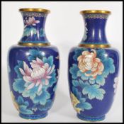 A 20th century pair of Chinese Cloisonne on brass baluster vases having decoration of flowers on