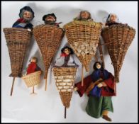 A collection of vintage push up puppets dating from the 20th Century, each puppet set within a