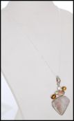 A stamped 925 silver pendant necklace with pendant of stones including a triangular hard stone drop,