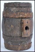 A Somerset cider wooden firkin with metal binding. Measures 20cm-high.