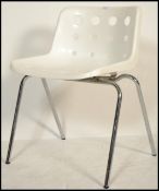 ROBIN DAY FOR HILLE CHAIR - A single stacking chair with plastic  moulded seat and raised on a
