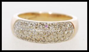A 9ct gold diamond ring set with diamonds in a domed illusion setting. Hallmarked London. Weight 3.
