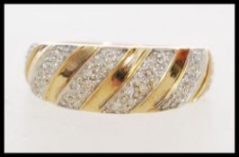 A 20th century hallmarked 9ct gold and diamond ring having illusion set diamonds in a domed setting.