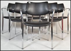 A set of  6 contemporary polished steel and black faux leather stacking chairs in the manner of