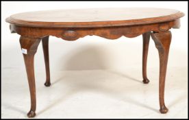 A 1930's large Queen Anne revival circular coffee - occasional table. Raised on cabriole legs with