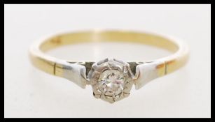 An 18ct gold diamond solitaire ring. Diamond approx 15pts.  Marked 750 tests 18ct gold. Weight 2.6g.