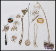 A collection of silver jewellery to include various chains, a purple agate pendant necklace, an