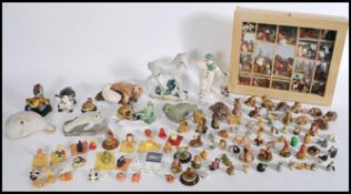 A collection of small ceramic figurines to include Wade Whimsies to include two tortoise