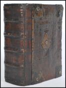 An early 17th century leather bound bible Authorised Edition believed 1614 with notes on doctrine