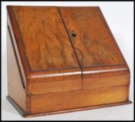 A Victorian Walnut desk tidy, the front hinging at