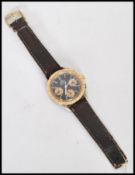 A vintage 18ct gold and stainless steel Omega Speedmaster Automatic watch having a black dial with