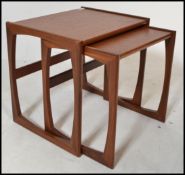 A G-Plan retro teak wood 1970's graduating nest of two tables in the Quadrille pattern. The tables
