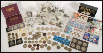 A large collection of coins dating from the 19th century to include Victorian examples, coins