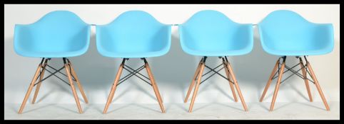 After Charles & Ray Eames - DAW Chairs - A set of 4 contemporary bucket / dining chairs / armchairs.