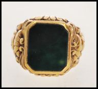 A vintage gentleman's 9ct / 375 hallmarked gold signet ring having bloodstone agate inset