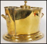 A Edwardian Ocean liner wine cooler having three compartments, the central one being lidded with a