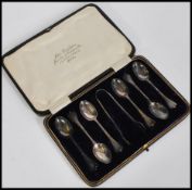 A cased set of six silver hallmarked teaspoons together with a pair of sugar tongs, Sheffield