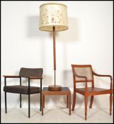 A 1970's retro teak wood and metal office chair with wool pad seat, a retro standard lamp and shade,