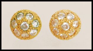 A pair of 20th century stamped 18k to the backs gold metal diamond cluster stud earrings. Weight 2.