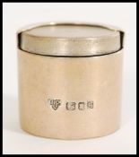 A 20th century silver hallmarked sovereign case by Garrard & Co Ltd of cylindrical form being