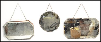 A group of three early 20th Century Art Deco frameless bevel edge mirrors, two of the mirrors with