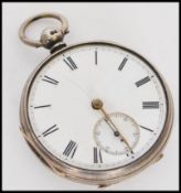 A 19th century silver hallmarked pocket watch having a white enamel face with roman numeral