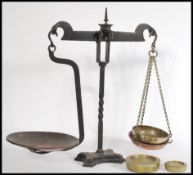 A set of Bartlett Bristol brass & cast iron shop scales, with two Parnall & Sons Ltd. brass