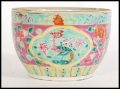 A 19th century Nyonya Chinese ceramic pot having hand enameled decoration on a famille rose ground