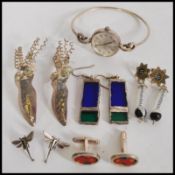 A collection of stylish designer silver - white metal costume jewellery to include stained glass