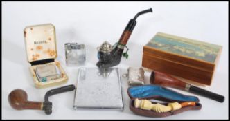A selection of vintage 20th century smoking related items to include a Meerschaum carved bone pipe