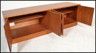 A vintage / retro 20th Century G-Plan low teak wood sideboard, drawers alongside cupboard doors